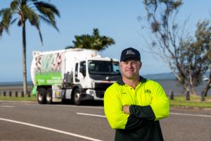 Justin green waste driver in front of truck